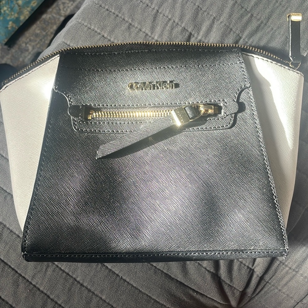 Calvin Klein clutch purse with zipper pouch on inside and out